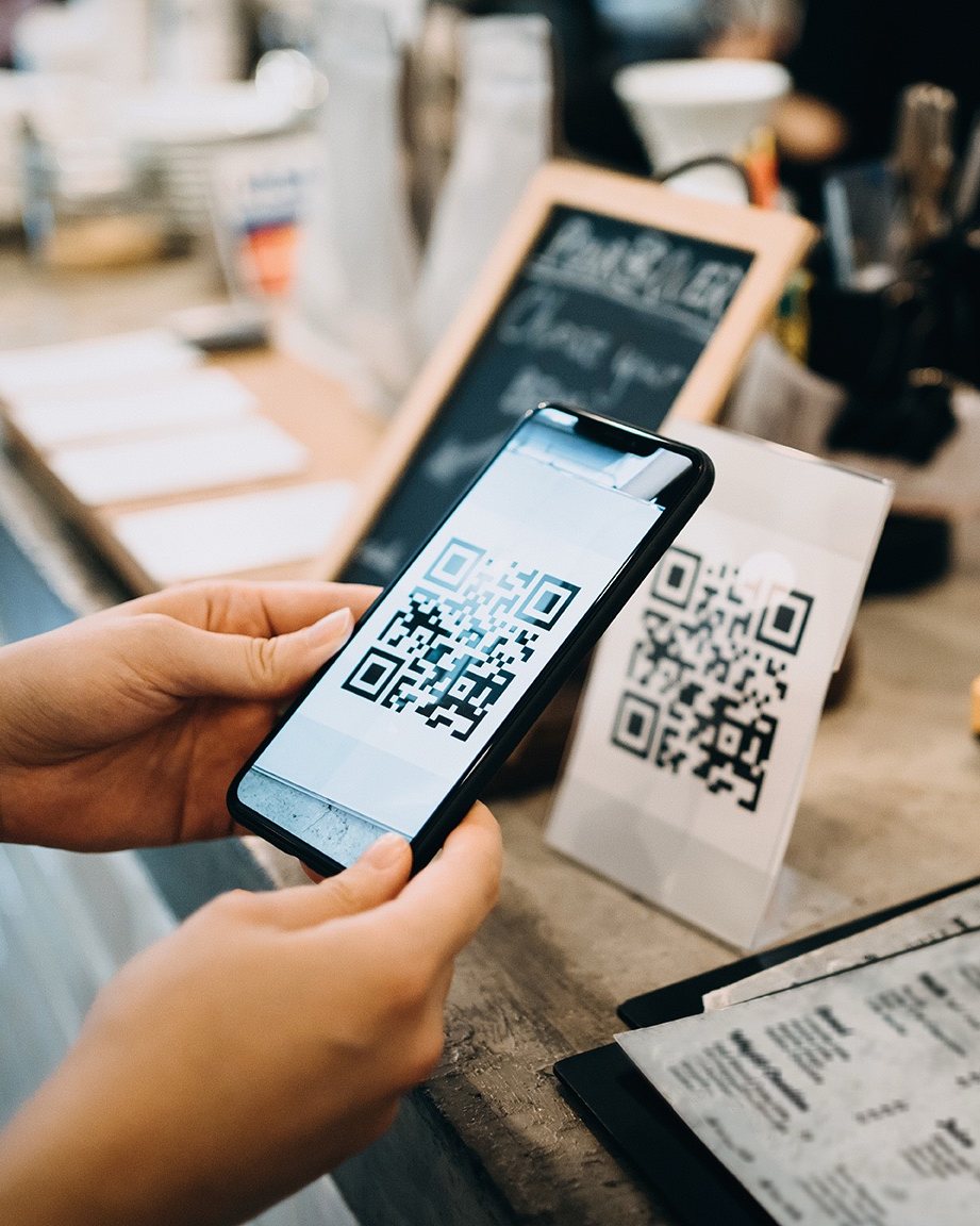Scanning a QR code at a shop counter